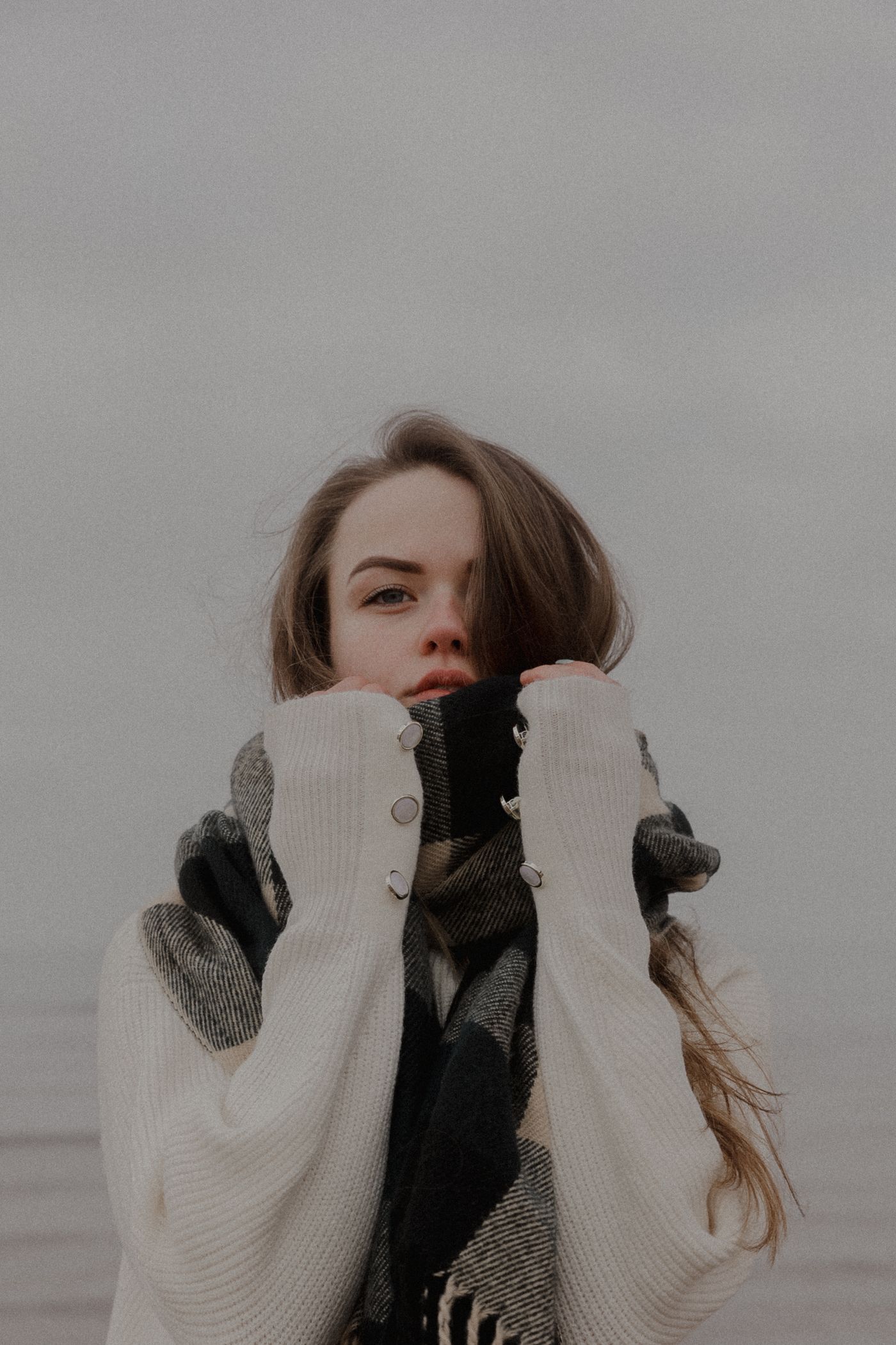 Monoloom Loom Knit, a heavy cream knit pulled up over the hands